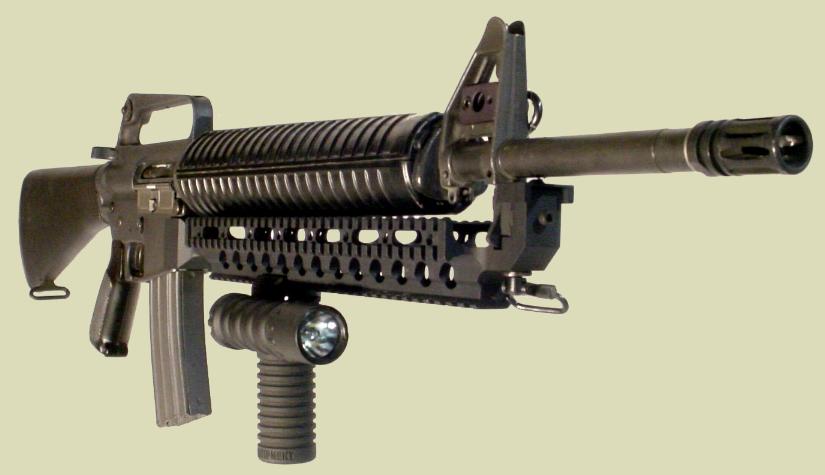 M16 rifle with the Fast Rail holding the RM Rail Grip with the Tactical Light.